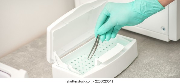 Hand Disinfects Tweezers With Cleaning Systems For Medical Instruments. Ultrasonic Cleaner