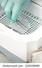 Hand Disinfects Tweezers With Cleaning Systems For Medical Instruments. Ultrasonic Cleaner