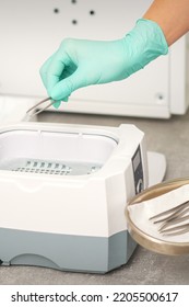 Hand Disinfects Tweezers With Cleaning Systems For Medical Instruments. Ultrasonic Cleaner