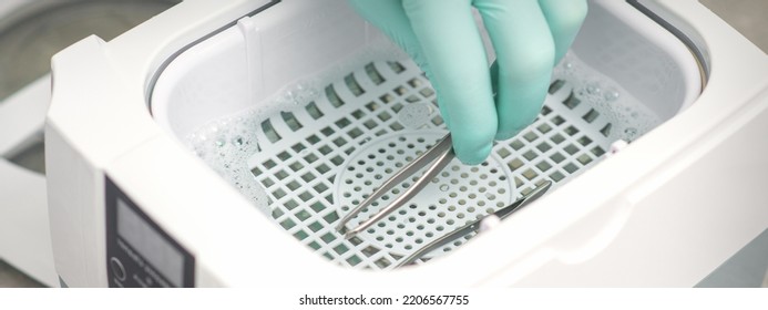 Hand Disinfects Tweezers With Cleaning Systems For Medical Instruments. Ultrasonic Cleaner