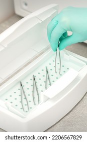 Hand Disinfects Tweezers With Cleaning Systems For Medical Instruments. Ultrasonic Cleaner