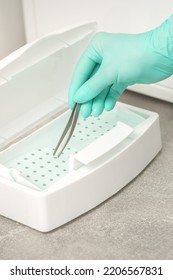 Hand Disinfects Tweezers With Cleaning Systems For Medical Instruments. Ultrasonic Cleaner