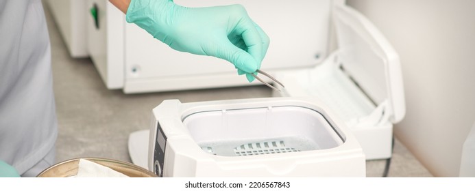 Hand Disinfects Tweezers With Cleaning Systems For Medical Instruments. Ultrasonic Cleaner