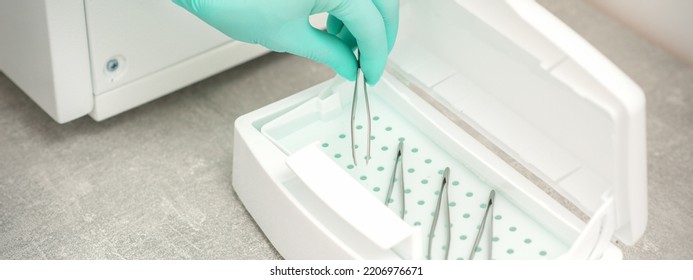 Hand Disinfects Tweezers With Cleaning Systems For Medical Instruments. Ultrasonic Cleaner