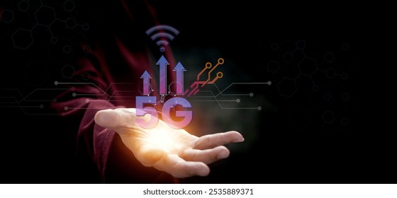 A businessman’s hand displays a 5G hologram, symbolizing concepts such as connectivity, cloud computing, cloud technology, data storage, network services, and high-speed internet. - Powered by Shutterstock