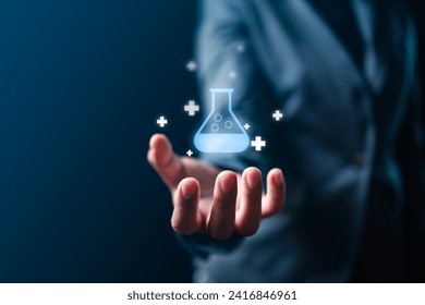 a hand displays futuristic medical research and development on a virtual screen icon. Witness the synergy of technology and medicine in this captivating image - Powered by Shutterstock