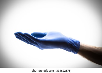 Hand Doctor In Blue Gloves On A White Background