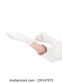 Hand Of Doctor Pulling On White Surgical Gloves