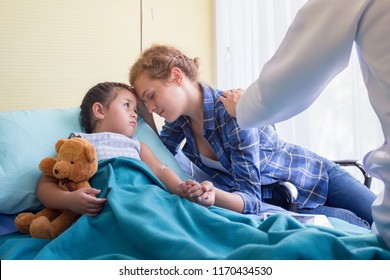 Hand Of Doctor Reassuring Patient Family With Child Patient On Hospital Bed At The Patient Room In Hospital / Teddy Bear Is A Best Friend For All Little Cute Girl -  Medical Healthcare Concept.