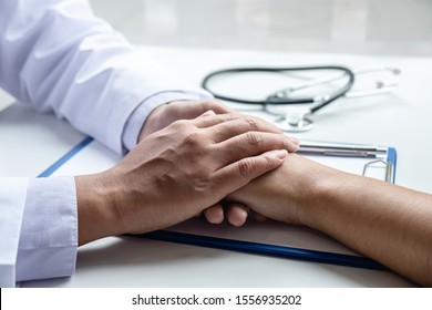 Hand Of Doctor Touching Patient Reassuring For Encouragement And Empathy To Support While Medical Examination On The Hospital.