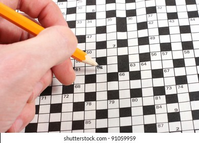 Hand Doing Crossword