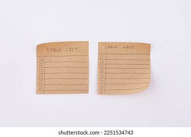 hand draw checklist on note taped recycle paper