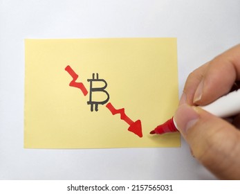 Hand Drawing A Downward Graph Depicting Bitcoin Plunge