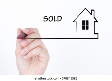 Hand Drawing A House With Word SOLD , Financial And Real Estate Concept