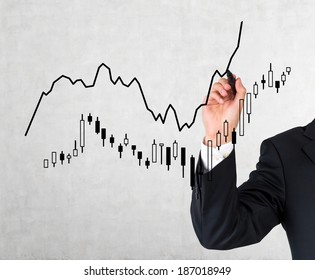 A hand drawing a market bar-chart 