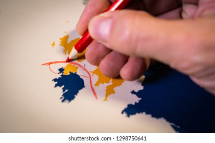 Hand Drawing A Red Line Between The UK And Northern Ireland, Backstop And Brexit Concept. The Backstop Solution For The Irish Border Is One Of The Main EU And UK Negotiations.