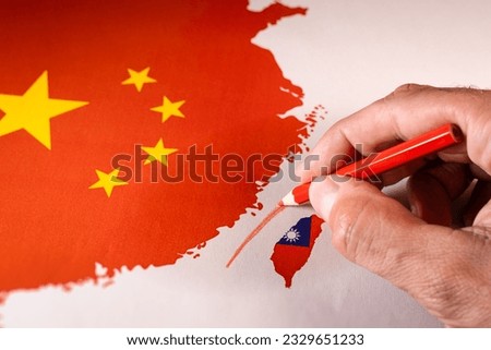 Hand drawing a red line between Taiwan isle and Mainland China.
