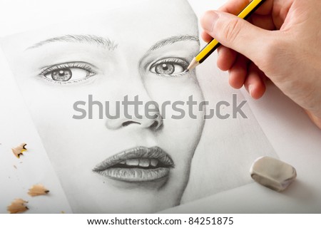 Hand Drawing a Woman Face with Pencil
