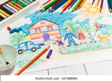 Hand drawn Bright Childrens Sketch With Happy Family  House  Dog  Car the Lawn and Flowers and lying pencils   pastel    concept children creativity  close up perspective view 