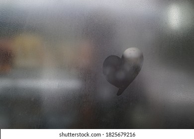 Hand Drawn Heart On Window.condensation Water Droplets In Mirror For Background.