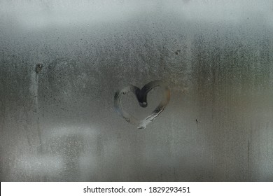 Hand Drawn Heart On Window.condensation Water Droplets In Mirror For Background.