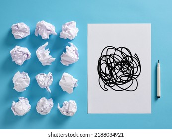 Hand Drawn Scribble Icon On A Paper Sheet With Crumpled Paper Balls And A Pen. Confusion, Dilemma, Distress, Mess, Disorder And Complication In Business Concept.