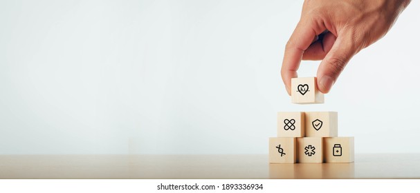 Hand drawn wooden block arrangement with healthcare medical icons Maintenance - Shutterstock ID 1893336934