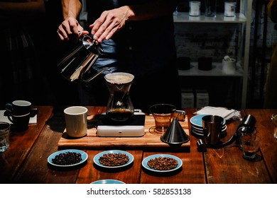 Hand drip coffee , Barista pouring water over the coffee powder - Powered by Shutterstock