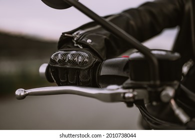 Hand Of Driver In Road Gloves Who Twists Accelerometer Lever While Standing. Biker Culture, Cafe Racers, Motorbike Aesthetics And Vintage Design Concept. Concept.