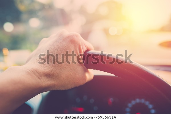 Hand driving car.  vintage\
filter