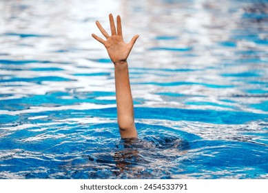 The hand of a drowning child in the pool. - Powered by Shutterstock