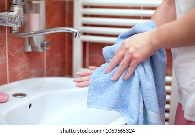 Hand Drying With Towel In Bathroom