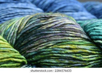 Hand dyed green, blue and purple merino yarn - Powered by Shutterstock