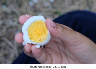 Hand Eating The Boiled Egg