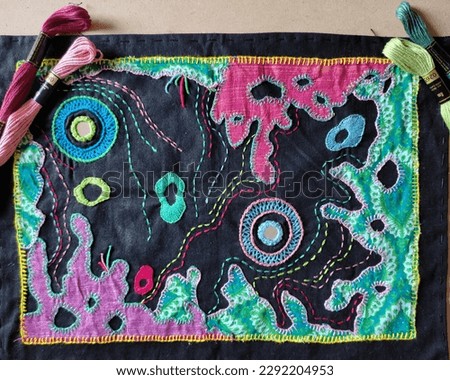 A Hand embroidered swatch using various embroidery stitches and applique work on Nautical (Underwater Theme).
