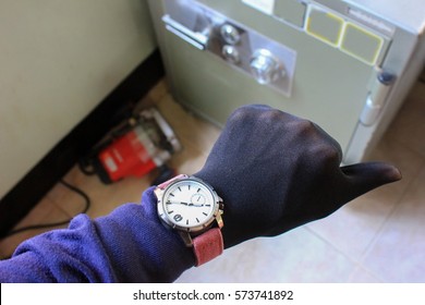 Hand Equipment And Tools Stealing A Safety Deposit Box.