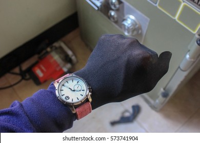 Hand Equipment And Tools Stealing A Safety Deposit Box.