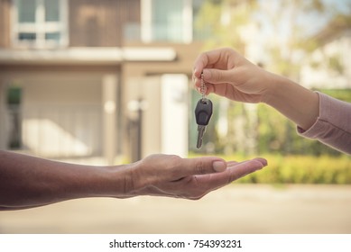 Hand Of Estate Agent Giving Home Keys To Person, Independent Man Purchasing New Home.