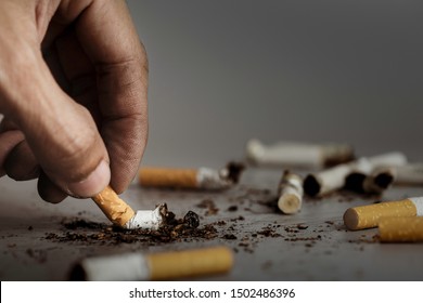 La cigarette éteint la main.La cigarette provoque une dépendance au cancer.Campagne de réduction du tabagisme à la Journée mondiale sans tabac.
