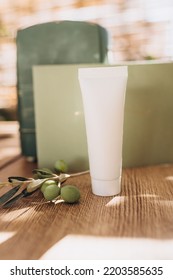 Hand And Face Or Body Cream Mockup On Green Background With Olive Branch