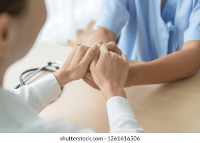 Hand Of Female Doctor Holding On Her Senior Patient - Selective Focus Point