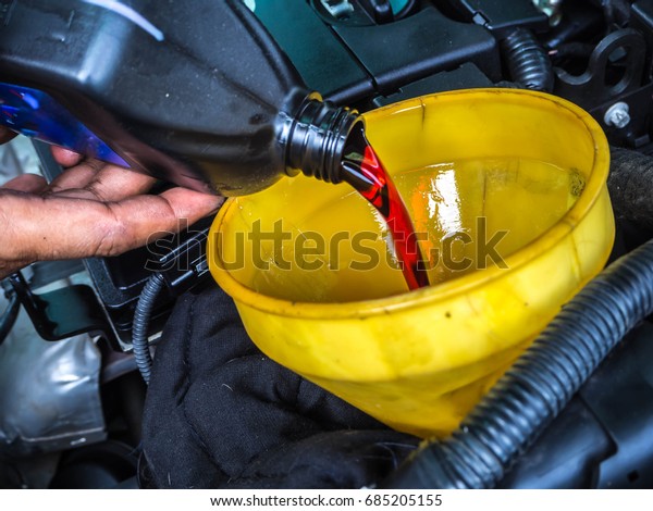 hand fill
up in a car engine with transmission
oil