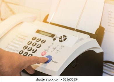 hand finger press transmitter fax send document is office equipment