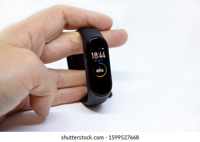 
hand with fitness bracelet on a white background