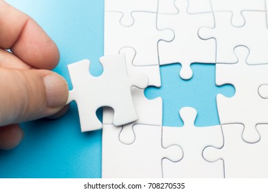 Hand Fitting Last Piece Puzzle Place Stock Photo (Edit Now) 708270535