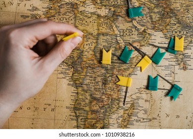 Hand with flags above the map