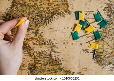 Hand with flags above the map