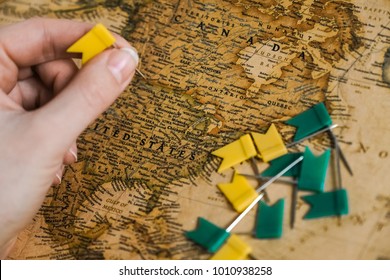 Hand with flags above the map