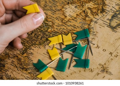 Hand with flags above the map