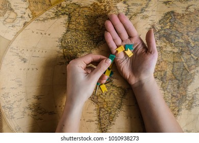 Hand with flags above the map